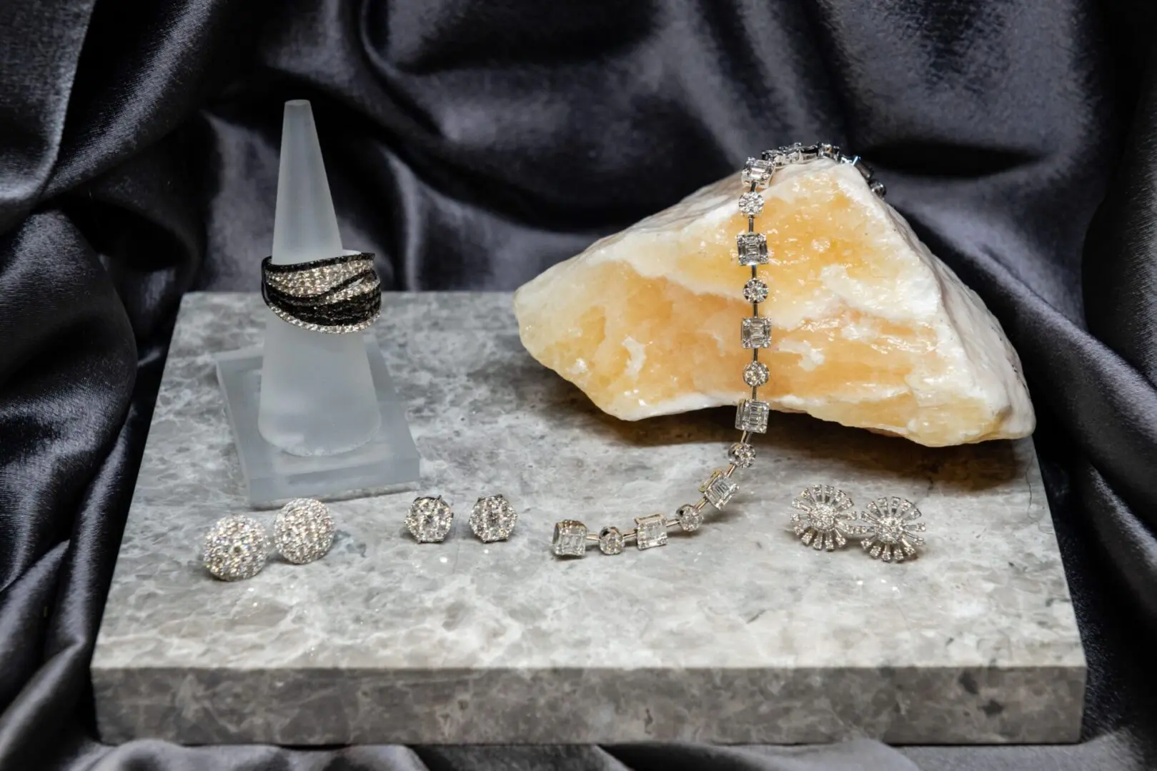 A table with jewelry and a rock on it