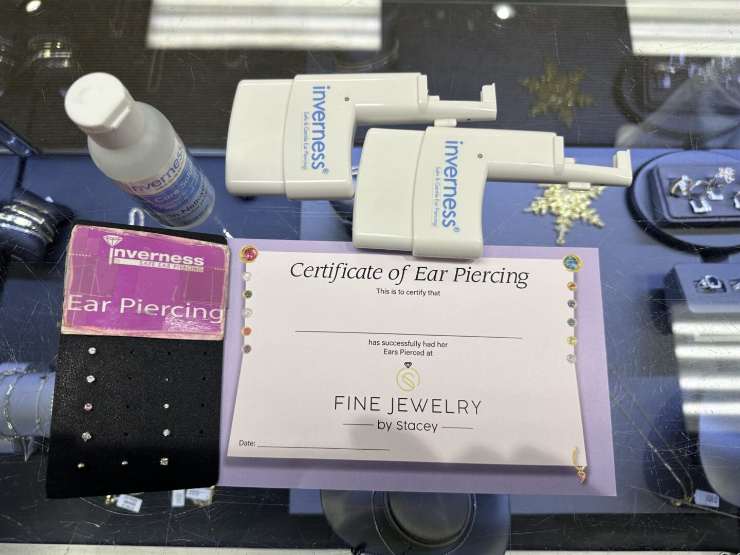 A certificate of ear piercing and some other items.